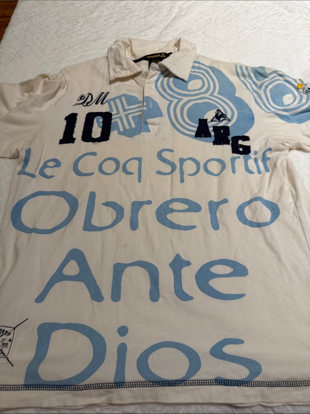 Le Coq Sportif White Polo with Light Blue Graphic Print and Navy Accents